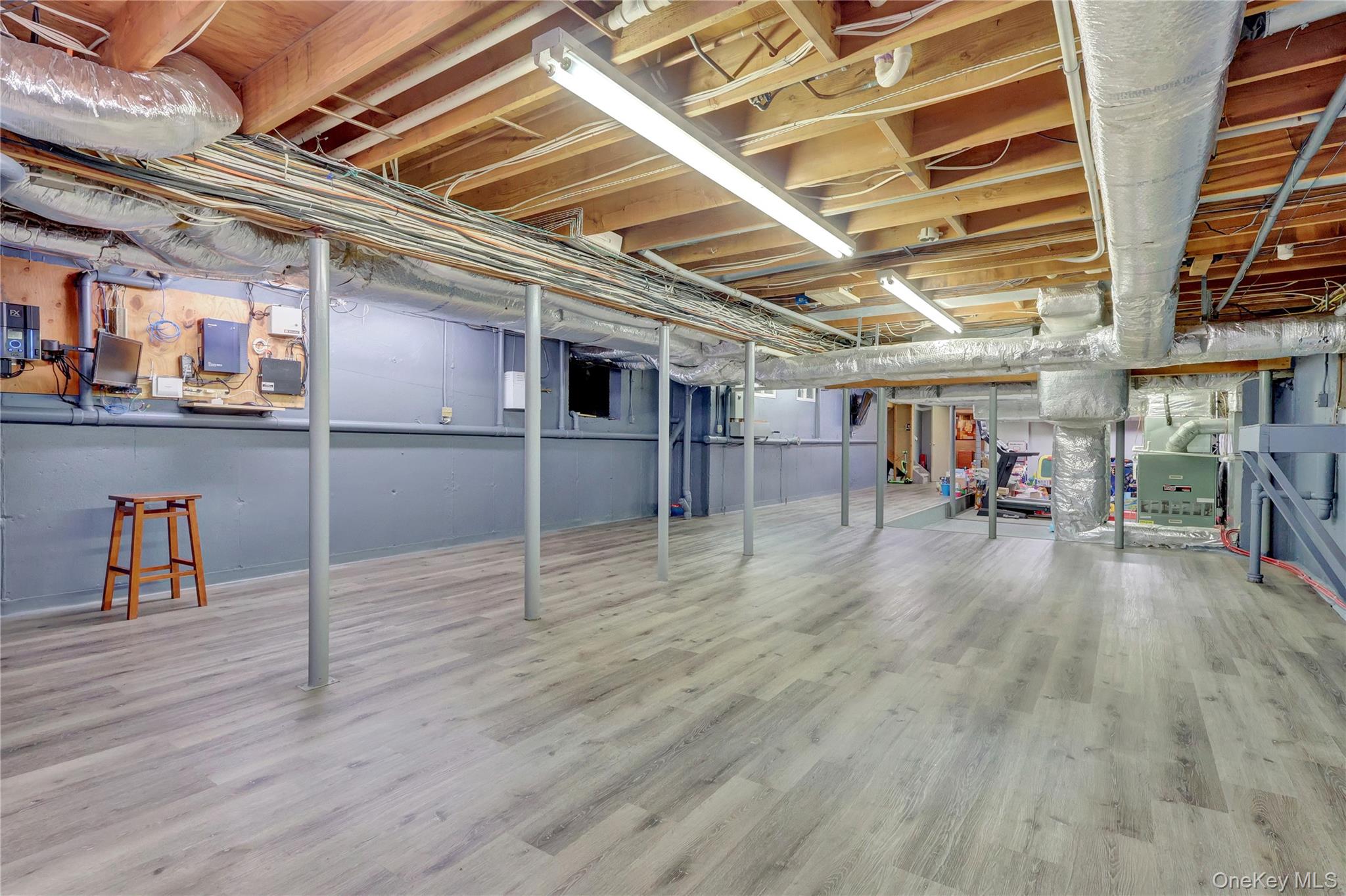 83 Cliff Road Port Jefferson, NY 11777 - Photo 36 of 50 Unfinished basement with wood finished floors
