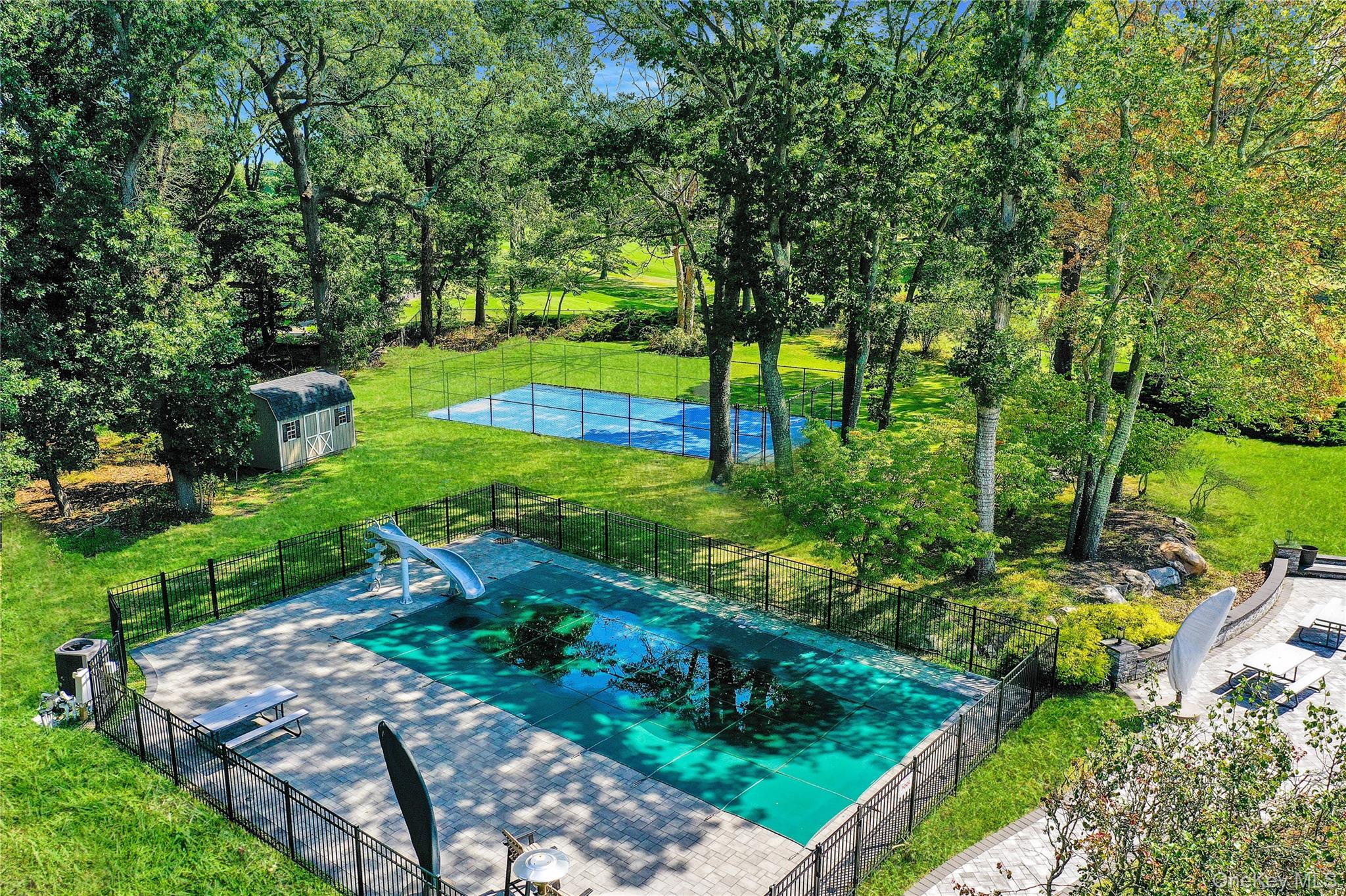 83 Cliff Road Port Jefferson, NY 11777 - Photo 38 of 50 View of pool featuring a patio and a shed