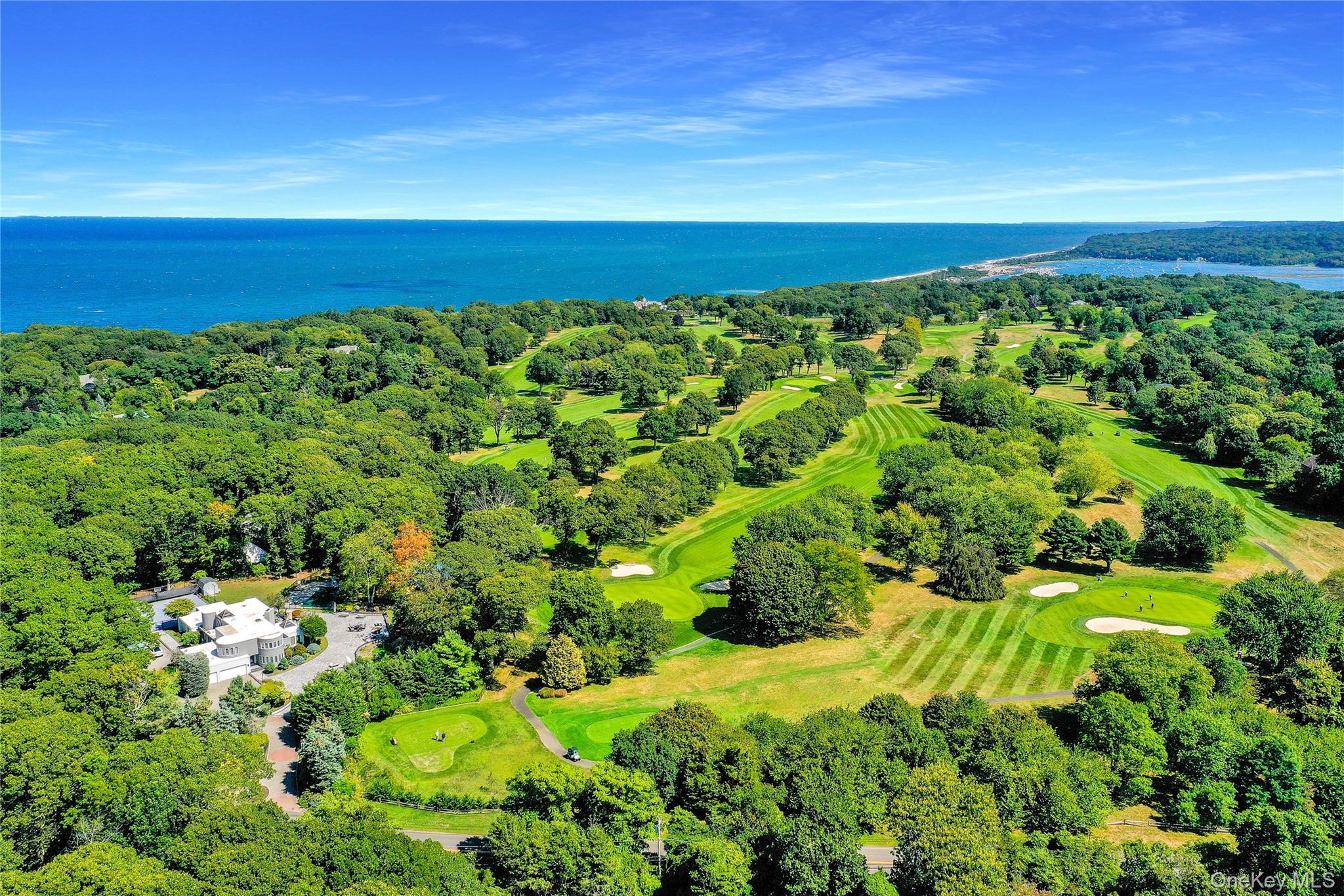 83 Cliff Road Port Jefferson, NY 11777 - Photo 40 of 50 Aerial view of a large body of water and a golf course