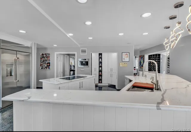 a living room with furniture and a large mirror