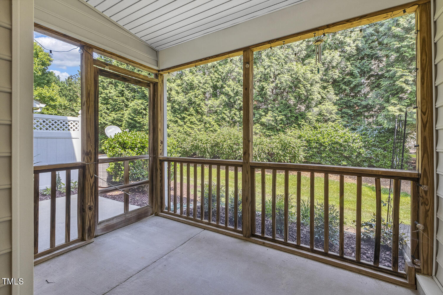 5936 Hourglass Court Raleigh, NC 27612 - Photo 11 of 15 a view of a porch with a floor to ceiling window