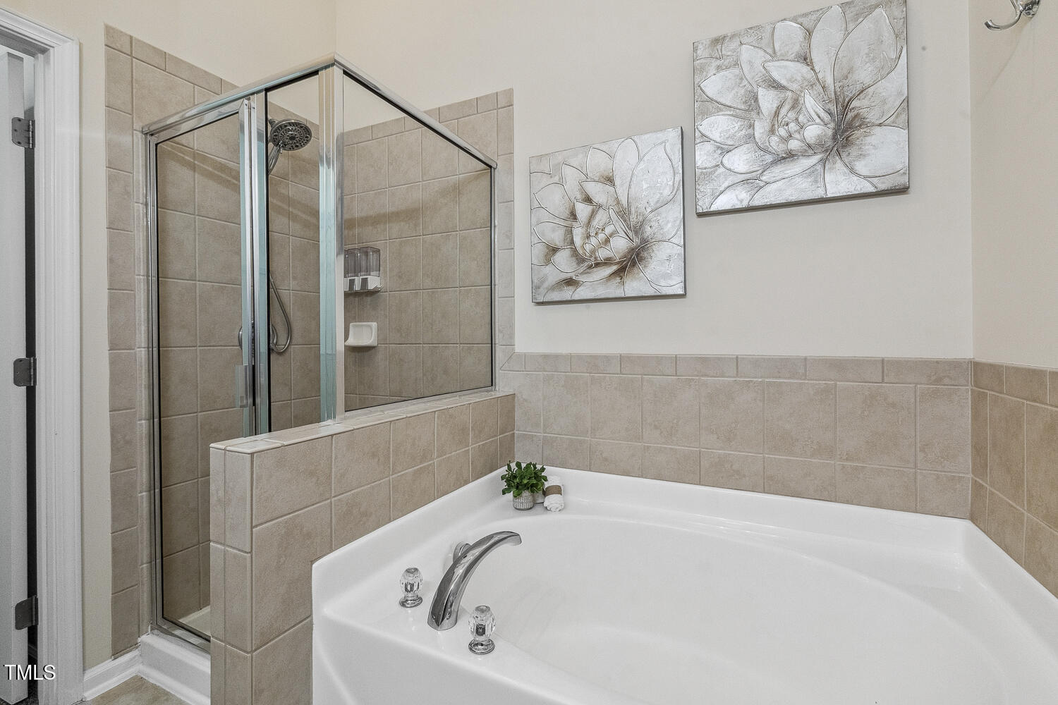 5936 Hourglass Court Raleigh, NC 27612 - Photo 10 of 15 a bathroom with a bathtub and a shower