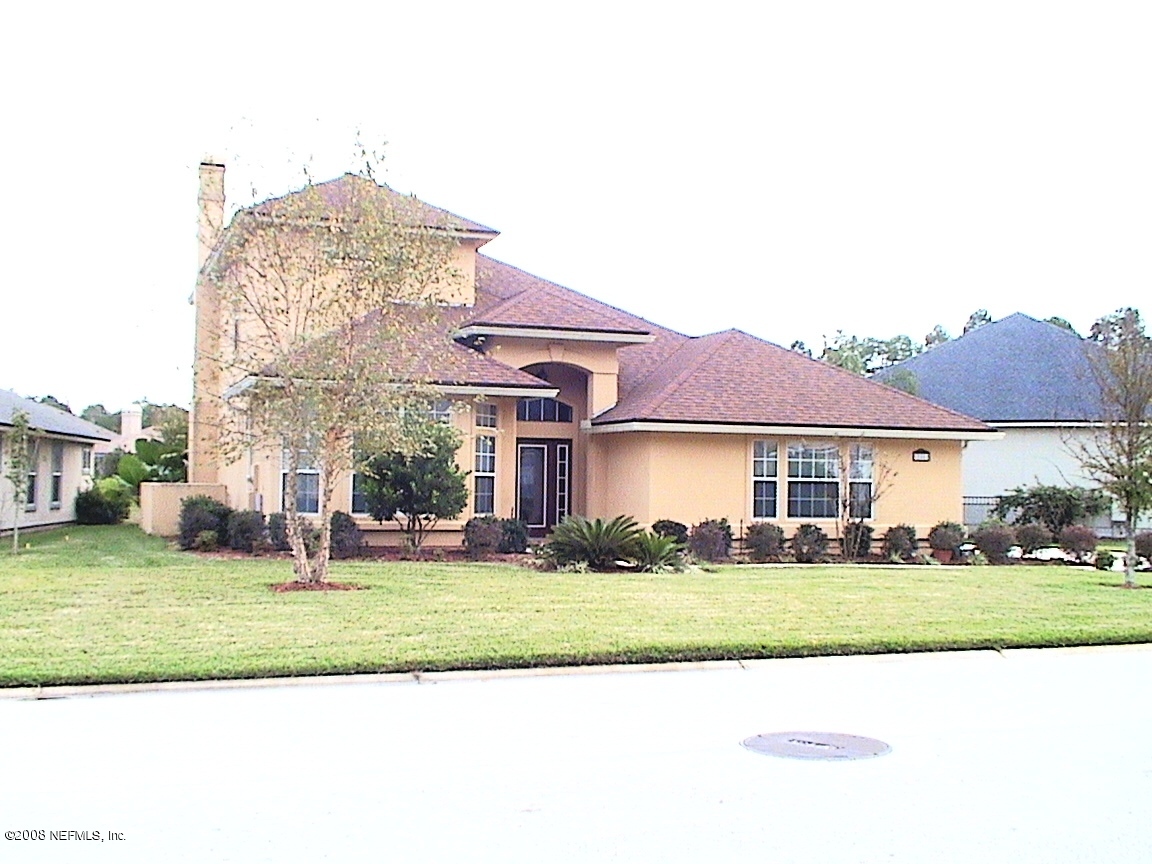 205 Edge Of Woods Road St. Augustine, FL 32092 - Photo 1 of 16 a front view of a house with a yard