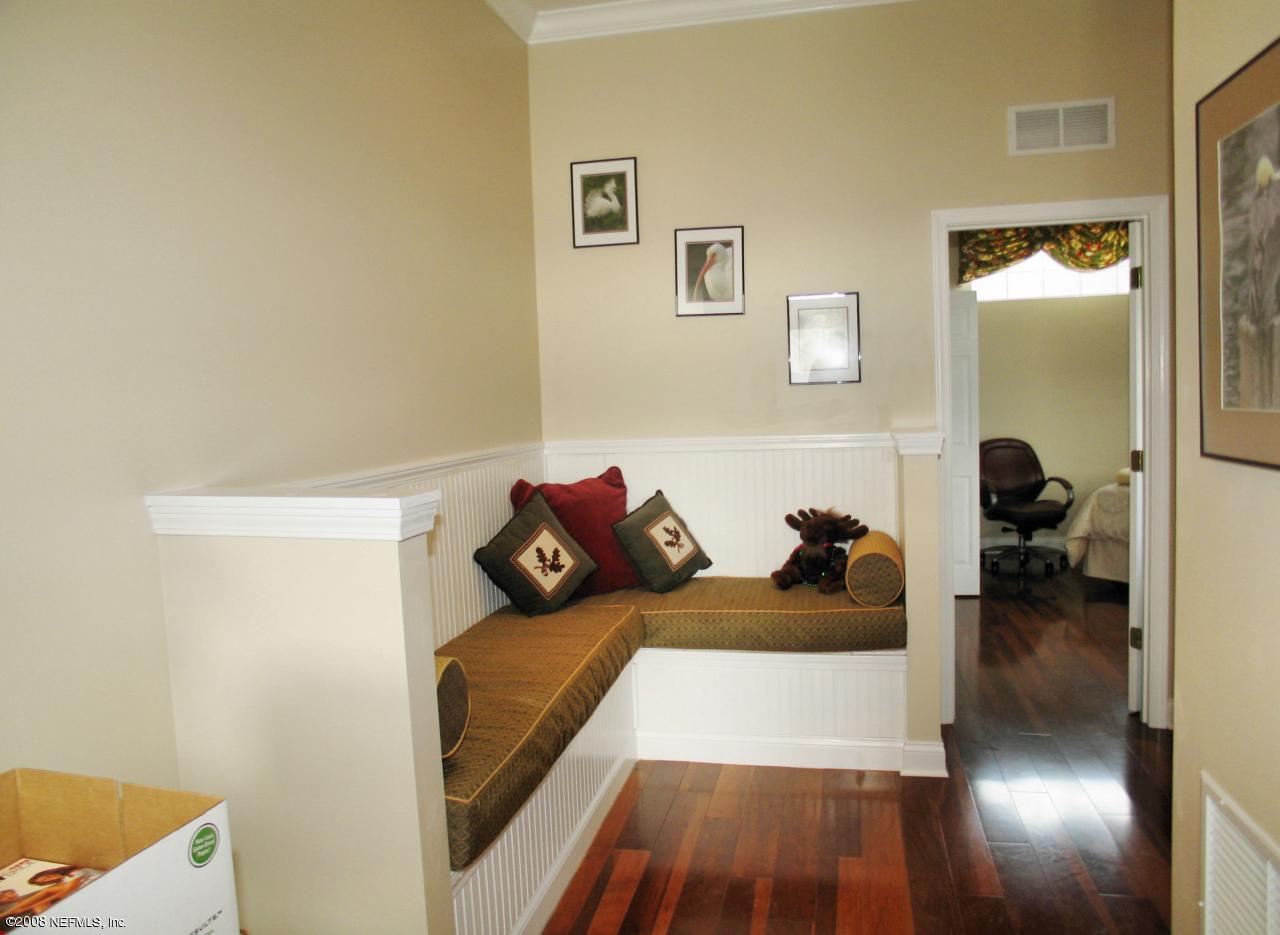 205 Edge Of Woods Road St. Augustine, FL 32092 - Photo 11 of 16 a bed room with a bed and a couch