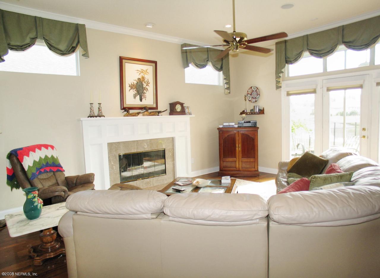 205 Edge Of Woods Road St. Augustine, FL 32092 - Photo 3 of 16 a living room with furniture and a fireplace