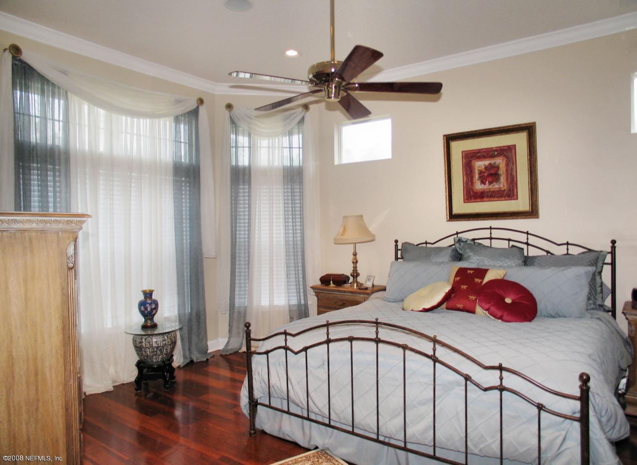 205 Edge Of Woods Road St. Augustine, FL 32092 - Photo 6 of 16 a bedroom with furniture and a window