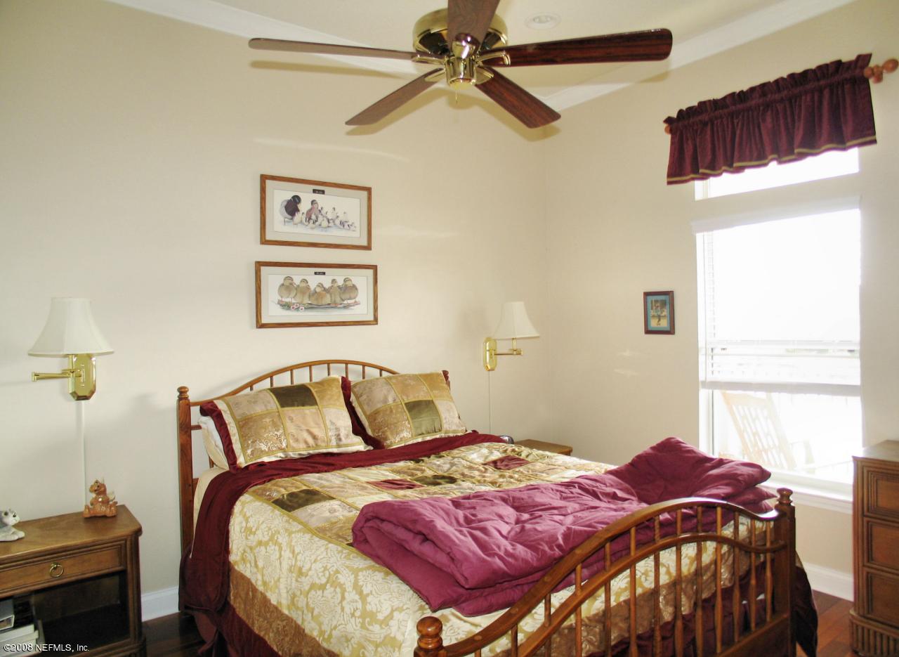 205 Edge Of Woods Road St. Augustine, FL 32092 - Photo 8 of 16 a bedroom with a bed and a window