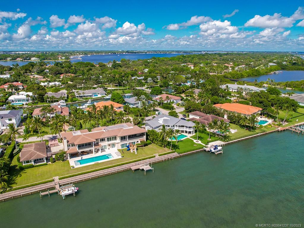 10 Island Road Stuart, FL 34996 - Photo 11 of 60 an aerial view of residential houses with outdoor space and lake view