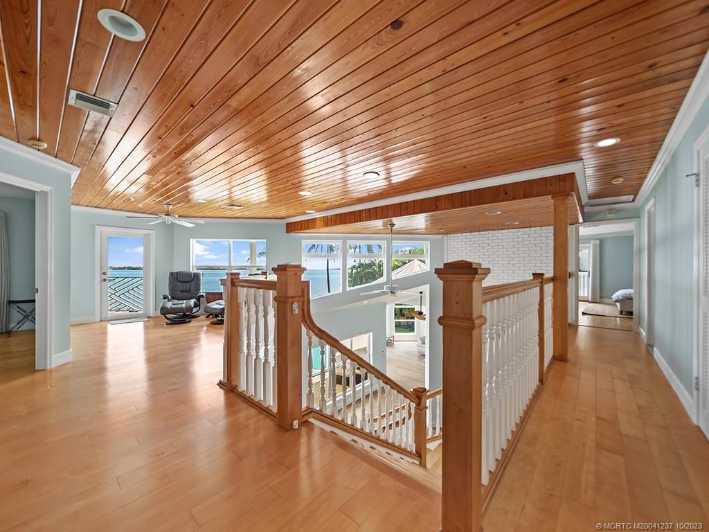 10 Island Road Stuart, FL 34996 - Photo 51 of 60 a view of a porch with furniture and wooden floor