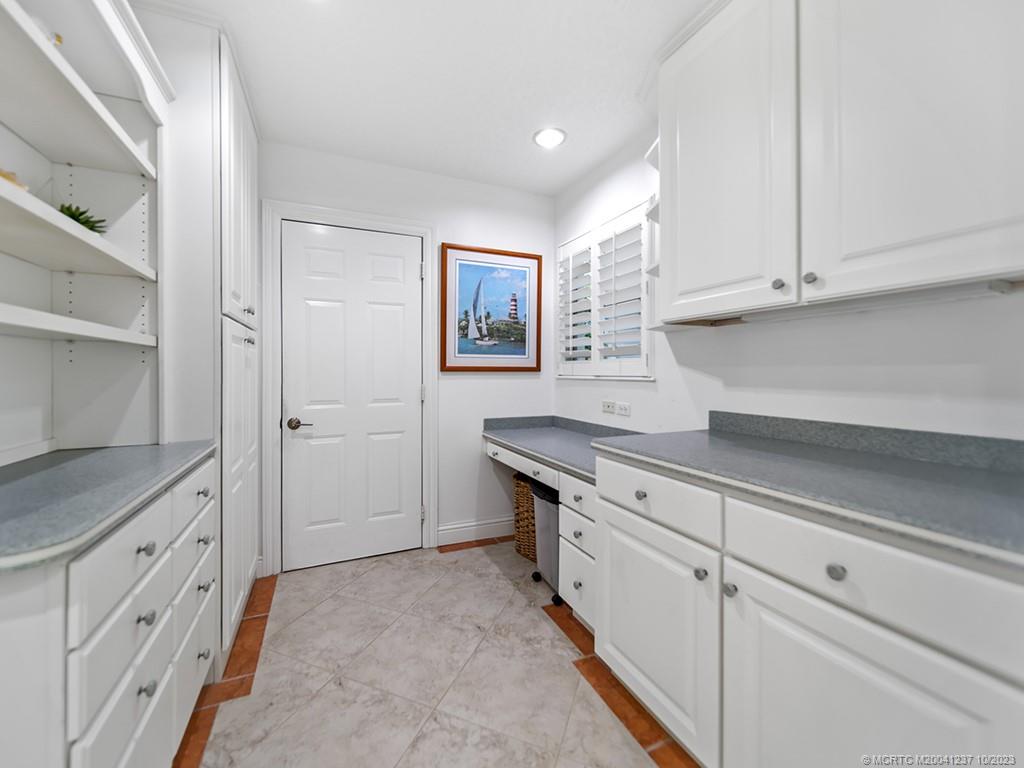 10 Island Road Stuart, FL 34996 - Photo 57 of 60 a room with cabinets and window