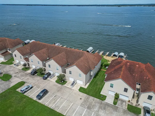 an aerial view of a house with outdoor space