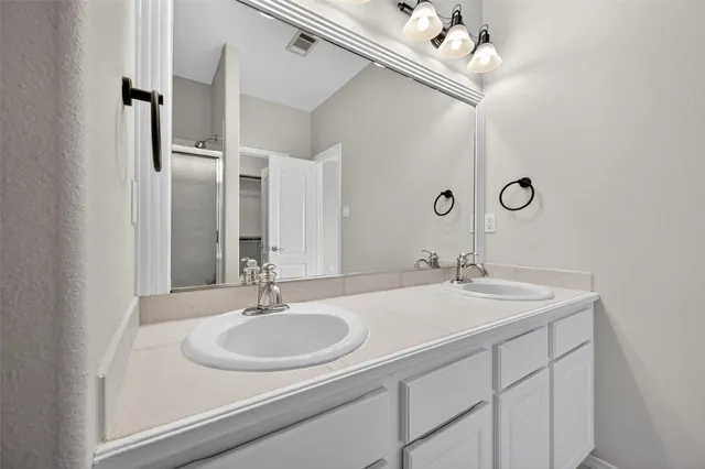 a bathroom with a shower and toilet