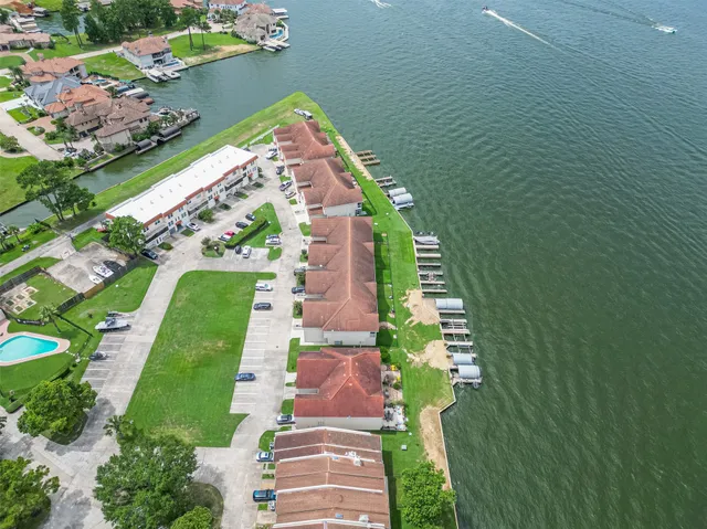 a view of a house with a yard and outdoor seating