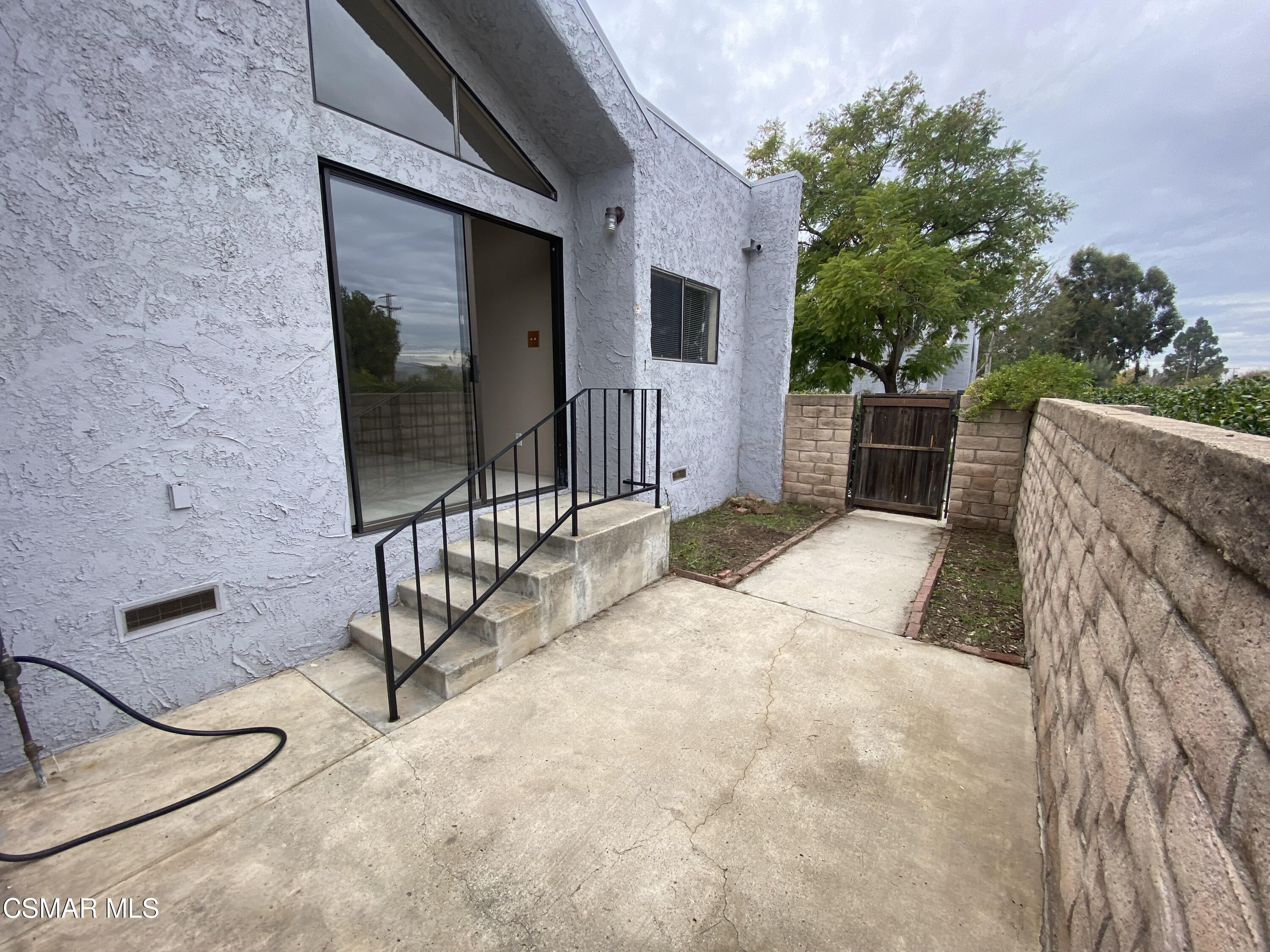 6416 Katherine Road, Unit D Simi Valley, CA 93063 - Photo 9 of 12 a view of balcony with two chairs and potted plants