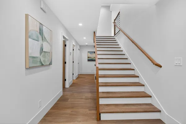 a bedroom with a large bed and a fireplace