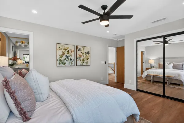 a bathroom with a shower sink and mirror