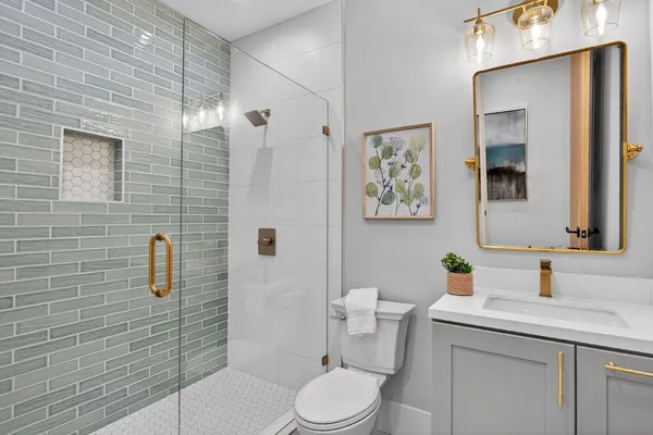 a bedroom with bed and a large window