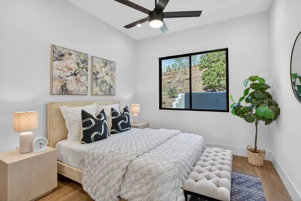 a bedroom with a bed and a desk