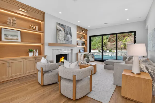 a living room with furniture and a fireplace