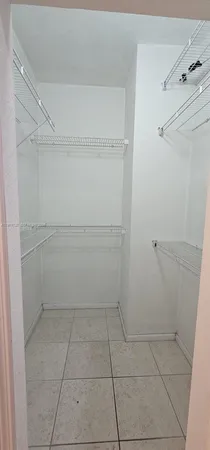a bathroom with a double vanity sink toilet mirror and shower