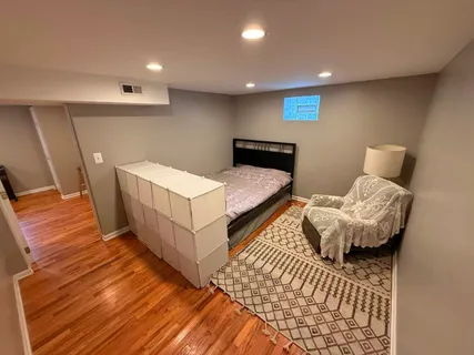 a bedroom with two beds and a couch