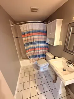 a bathroom with a sink a mirror and shower