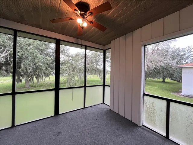 a view of an empty room with a large window