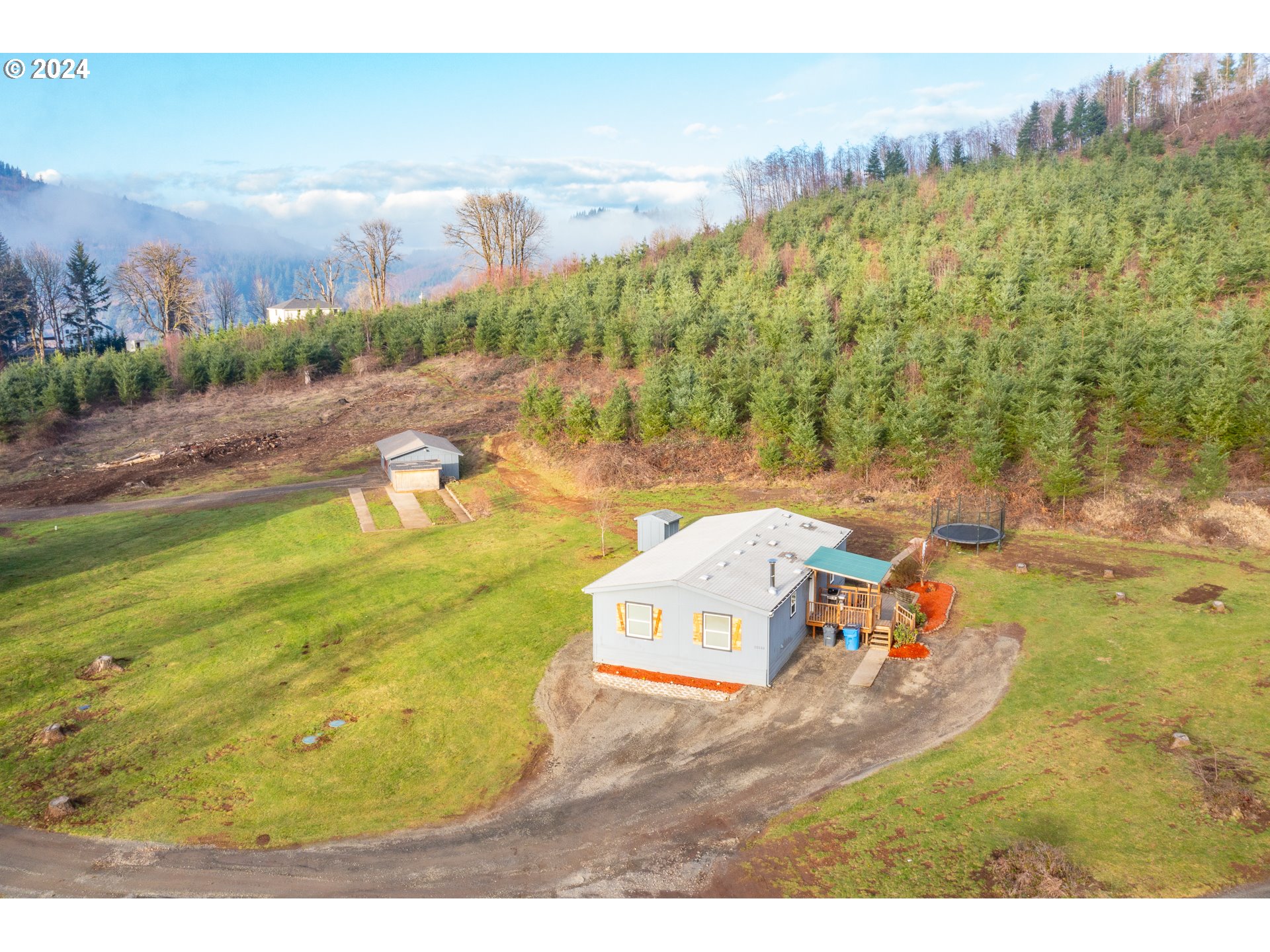 22233 Northeast Basket Flat Road Battle Ground, WA 98604 - Photo 12 of 46 a view of a swimming pool with an outdoor space