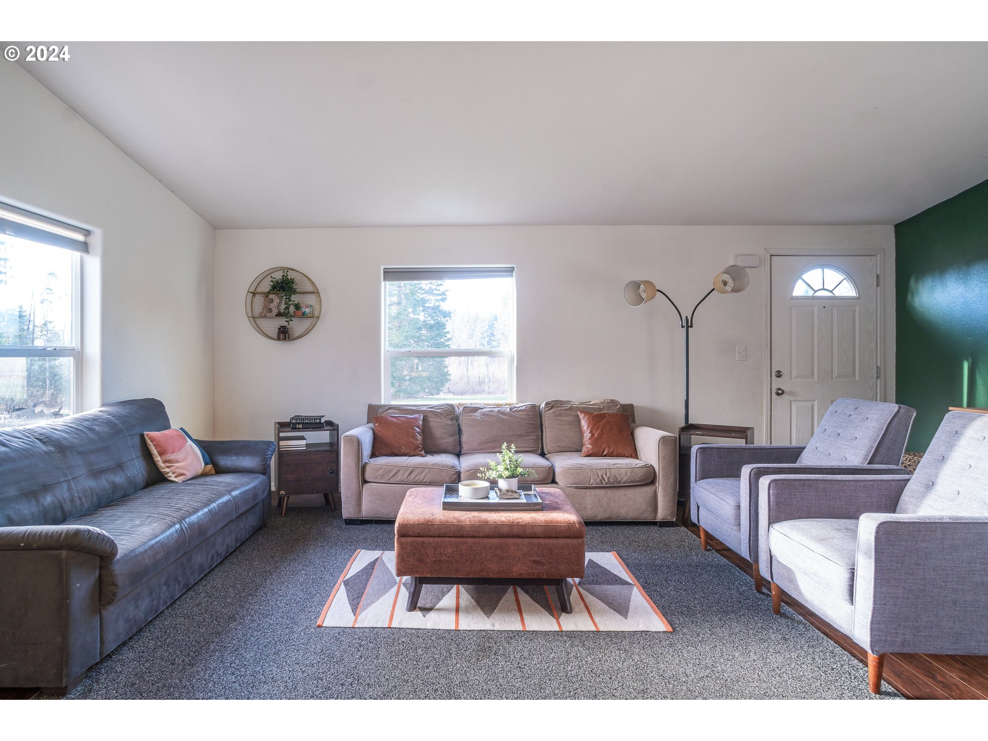 22233 Northeast Basket Flat Road Battle Ground, WA 98604 - Photo 16 of 46 a living room with furniture a rug potted plant and a window