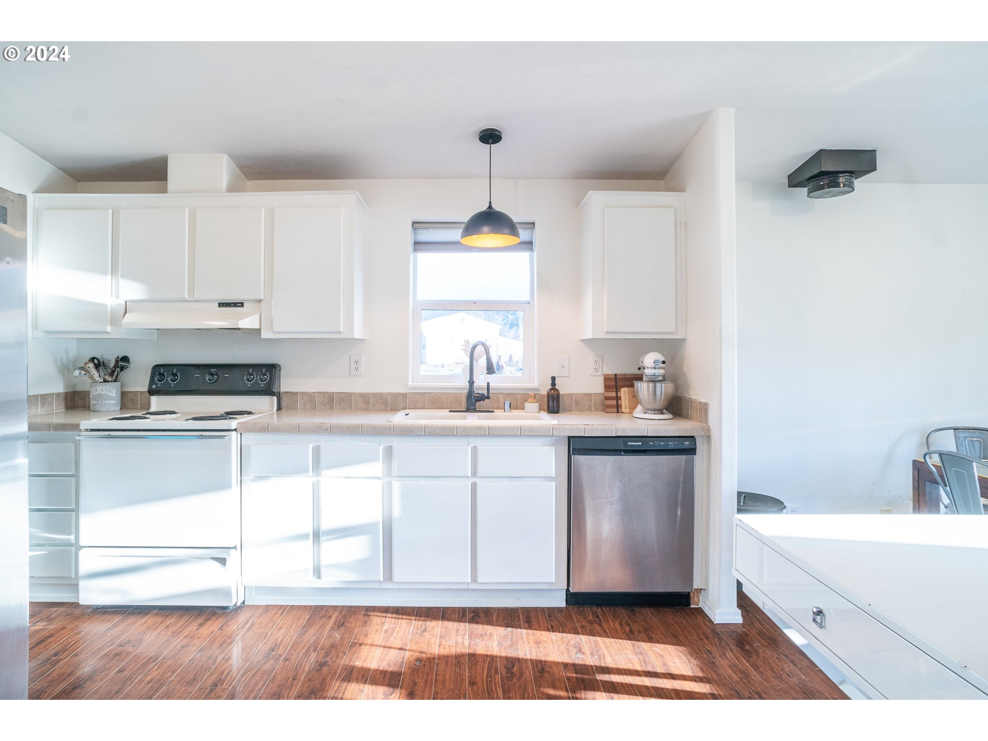 22233 Northeast Basket Flat Road Battle Ground, WA 98604 - Photo 19 of 46 a kitchen with a sink cabinets and window