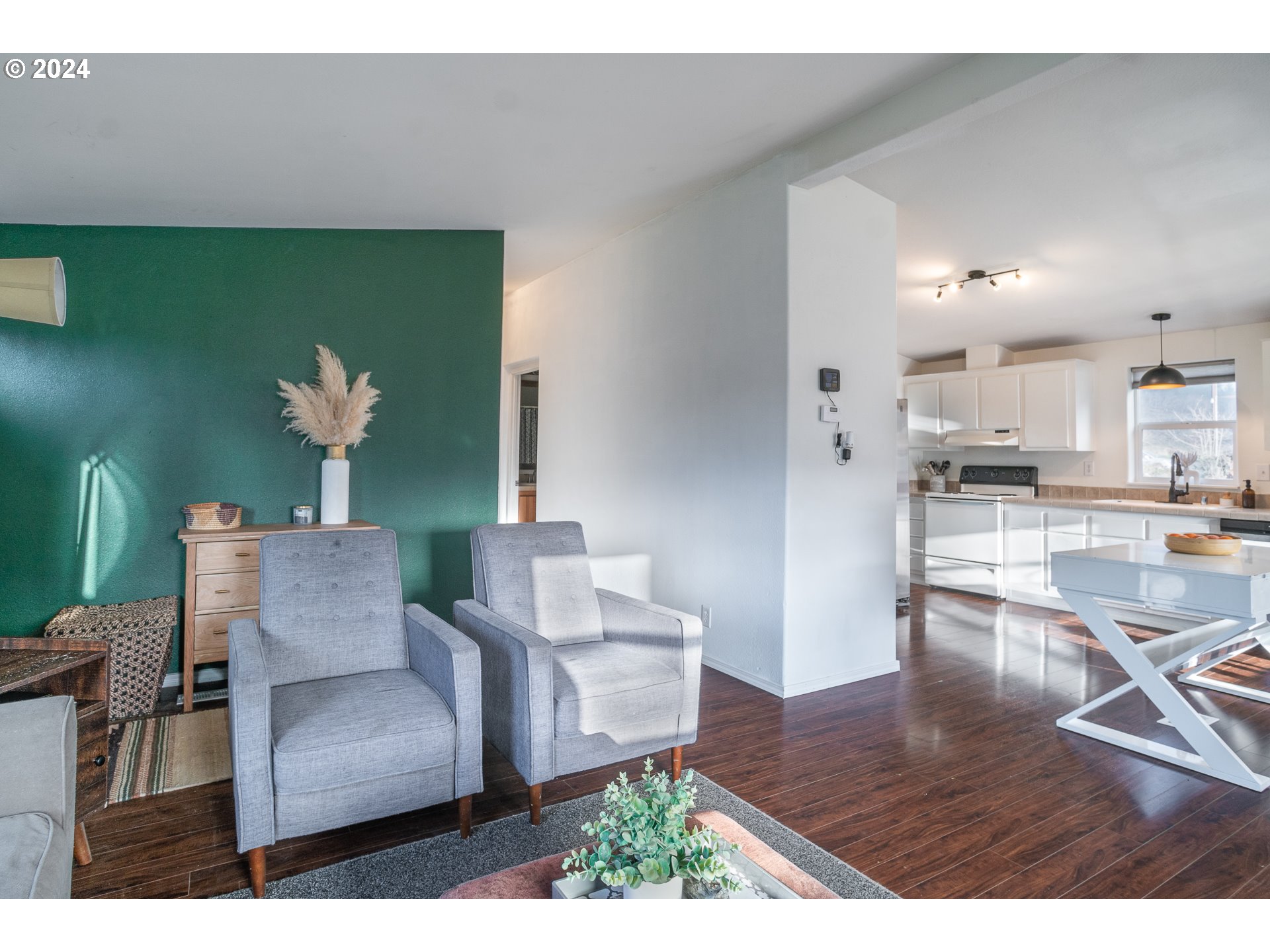 22233 Northeast Basket Flat Road Battle Ground, WA 98604 - Photo 20 of 46 a living room with furniture and a wooden floor