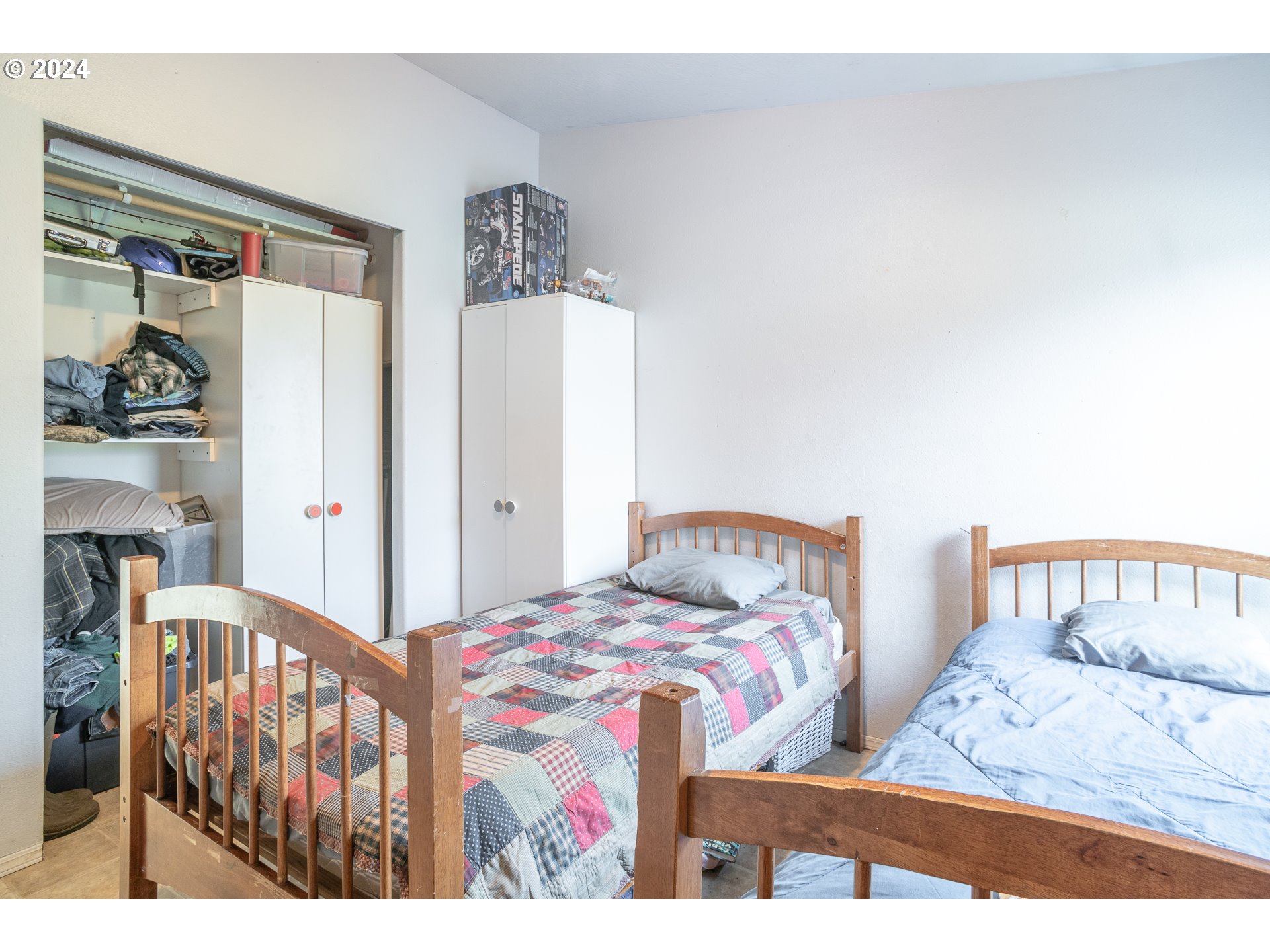 22233 Northeast Basket Flat Road Battle Ground, WA 98604 - Photo 26 of 46 a bedroom with two beds and a large mirror