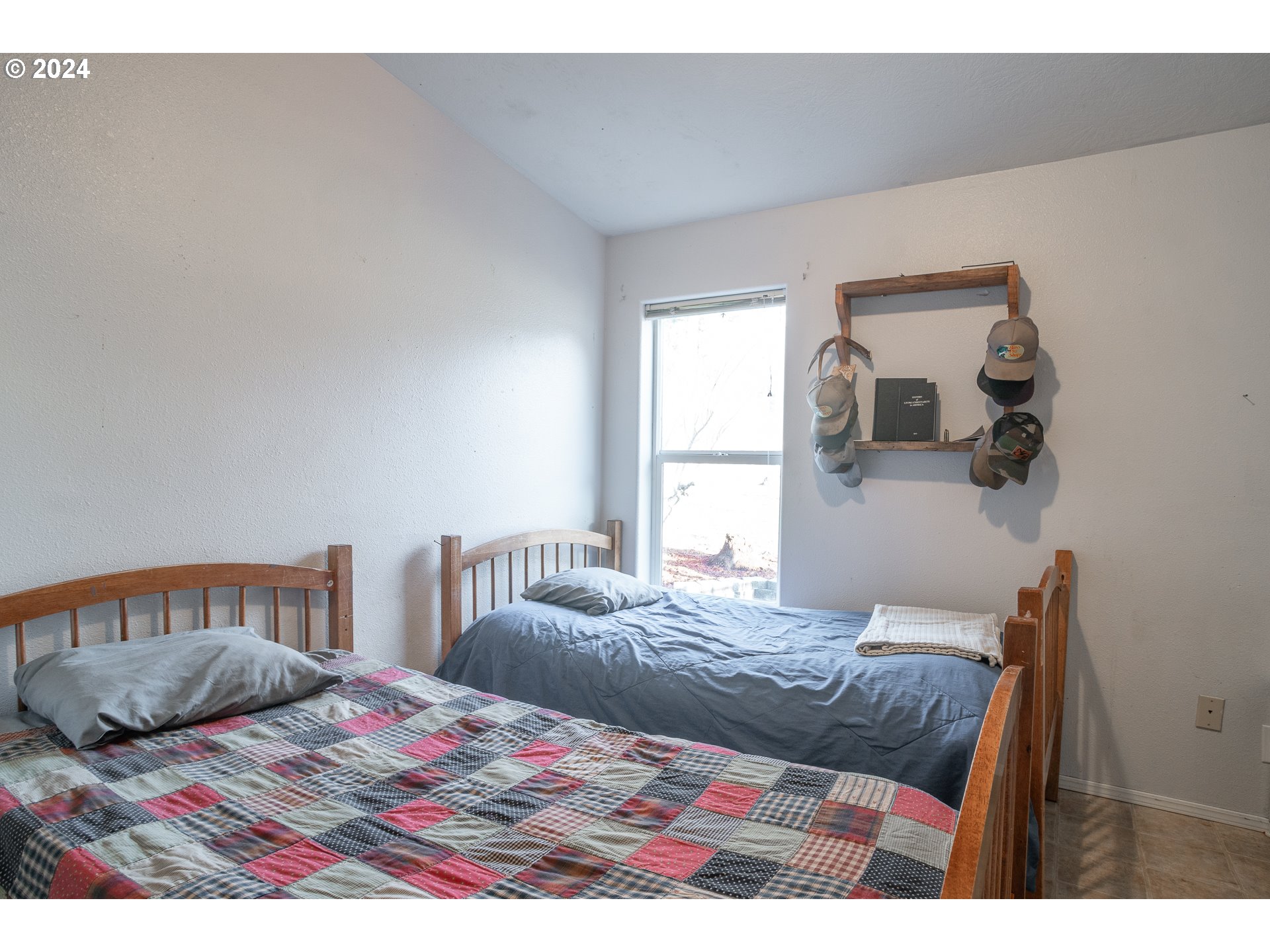22233 Northeast Basket Flat Road Battle Ground, WA 98604 - Photo 27 of 46 a bedroom with a bed and window