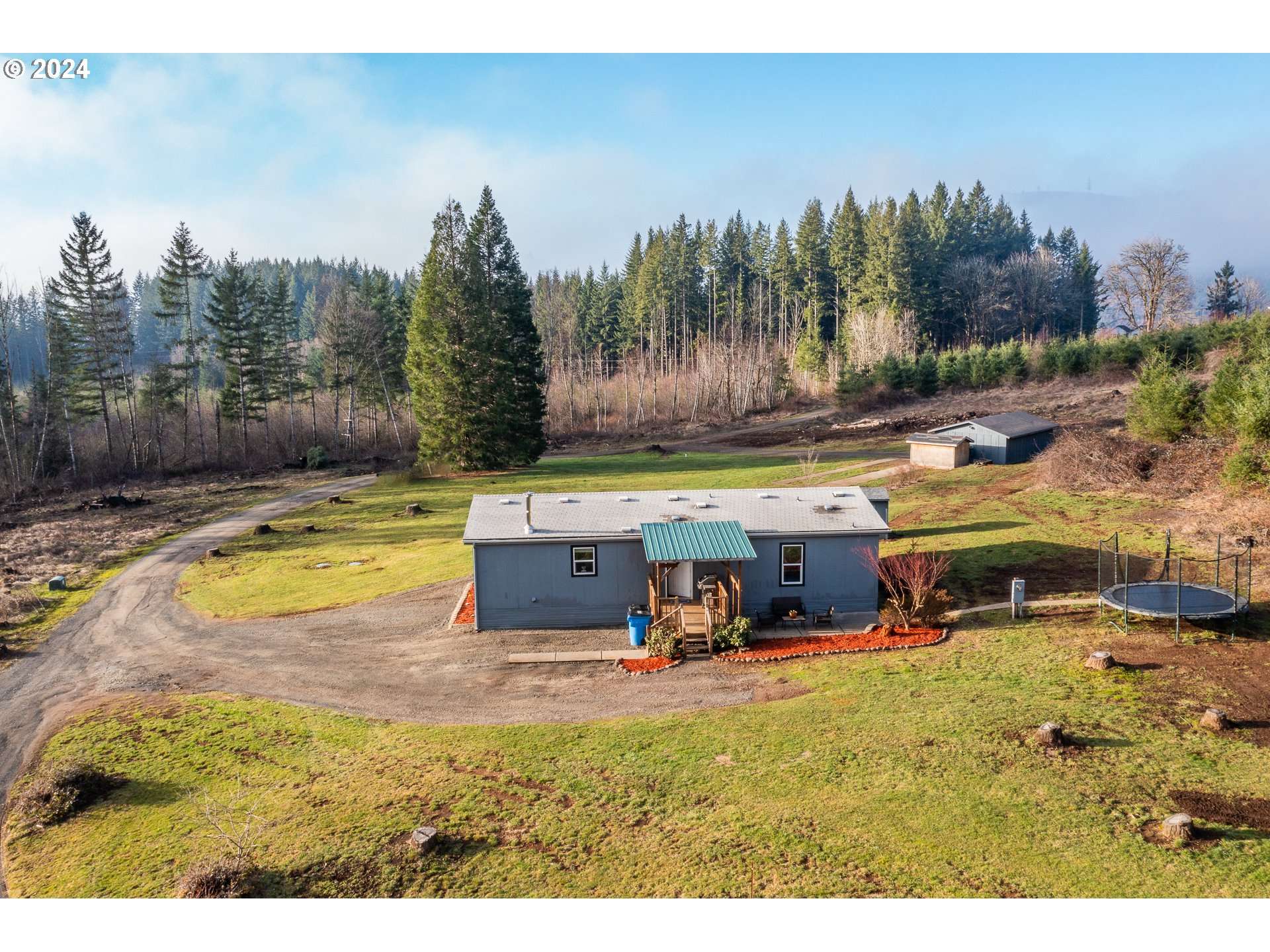22233 Northeast Basket Flat Road Battle Ground, WA 98604 - Photo 3 of 46 a view of a swimming pool with outdoor seating and a yard