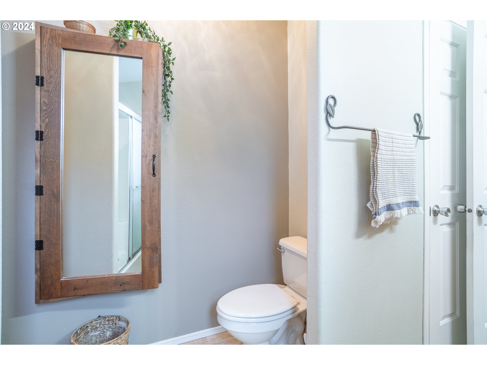22233 Northeast Basket Flat Road Battle Ground, WA 98604 - Photo 33 of 46 a bathroom with a toilet and a mirror