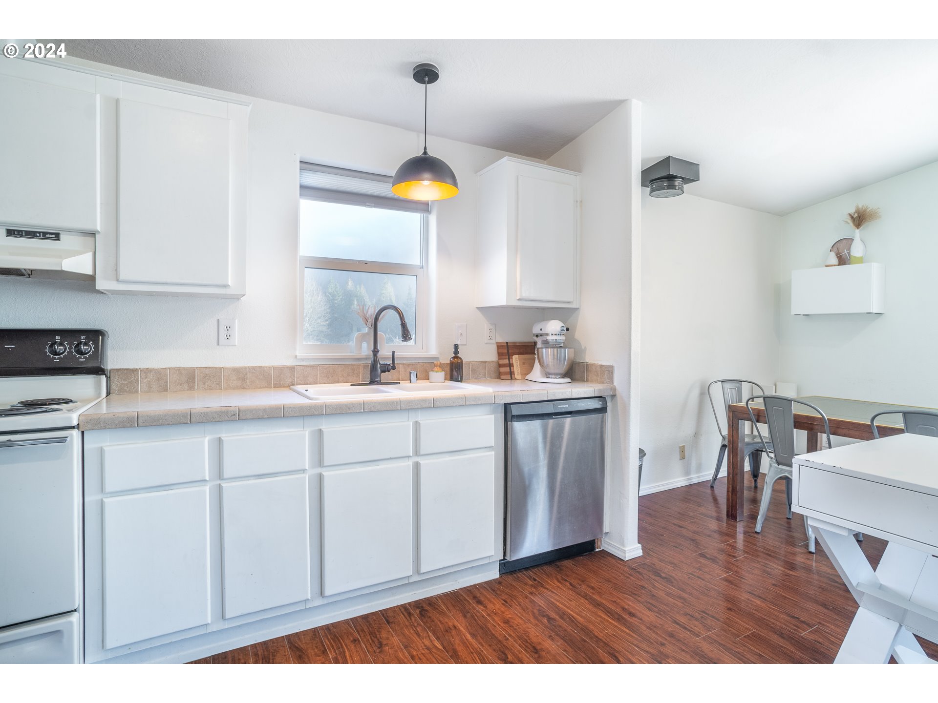 22233 Northeast Basket Flat Road Battle Ground, WA 98604 - Photo 37 of 46 a kitchen with a sink cabinets and wooden floor