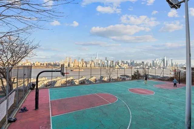 a kitchen with stainless steel appliances a stove a sink and a refrigerator