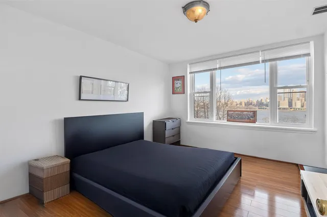 a bed room with furniture and a window