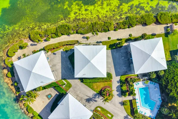an aerial view of a house with a yard