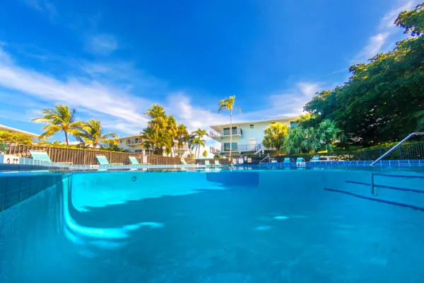 a view of a golf course with a swimming pool