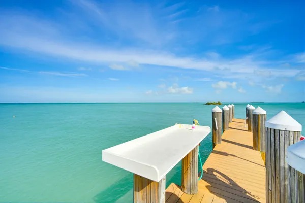 a view of swimming pool with a table and chairs