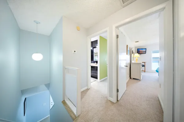 a bed sitting in a bedroom next to a balcony