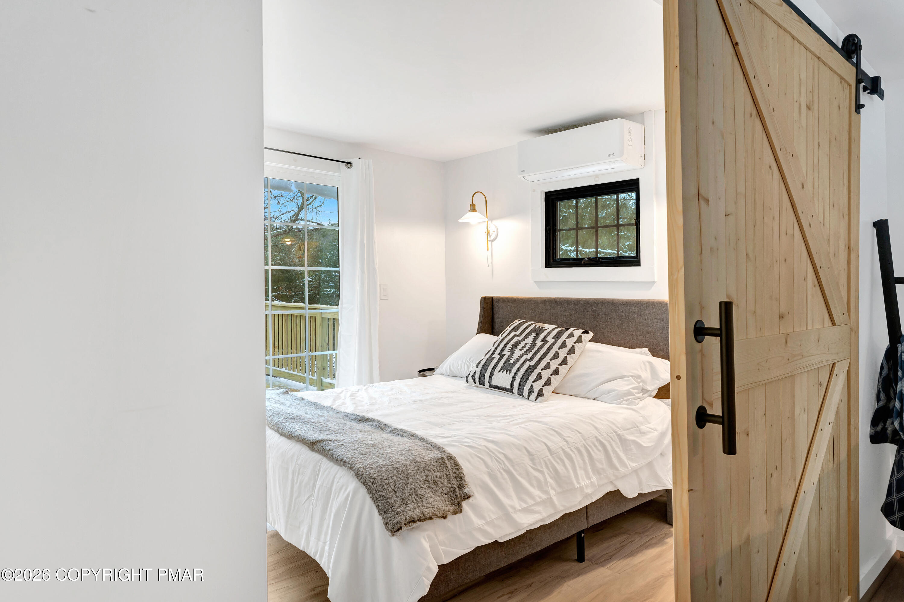 353 German Hill Road Shohola, PA 18458 - Photo 30 of 35 a bedroom with a bed and a window