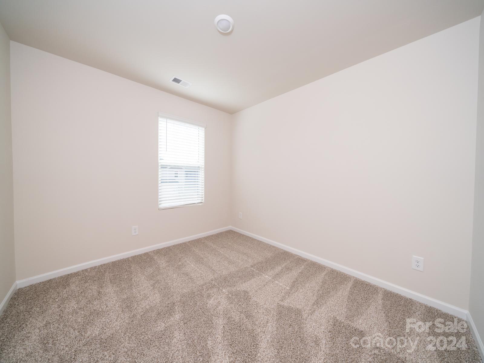 3840 Backwater Street Concord, NC 28027 - Photo 11 of 23 a view of an empty room with a window
