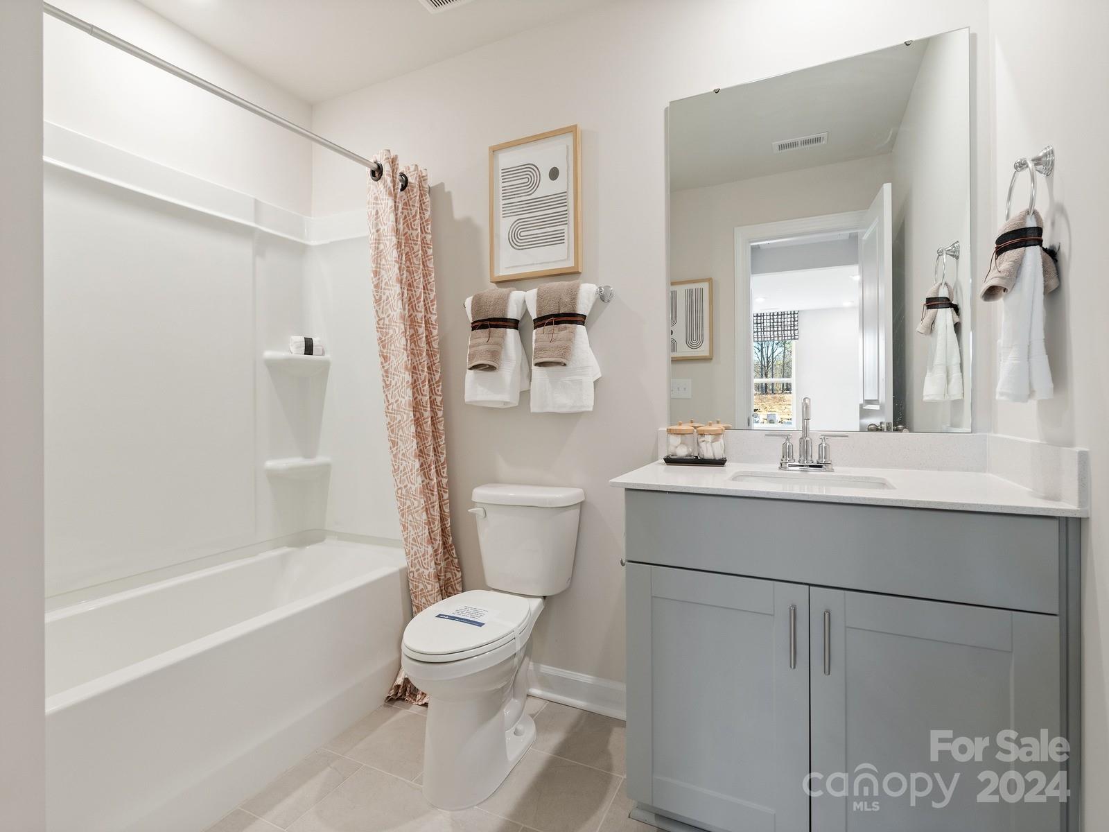 3840 Backwater Street Concord, NC 28027 - Photo 14 of 23 a bathroom with a sink toilet and shower