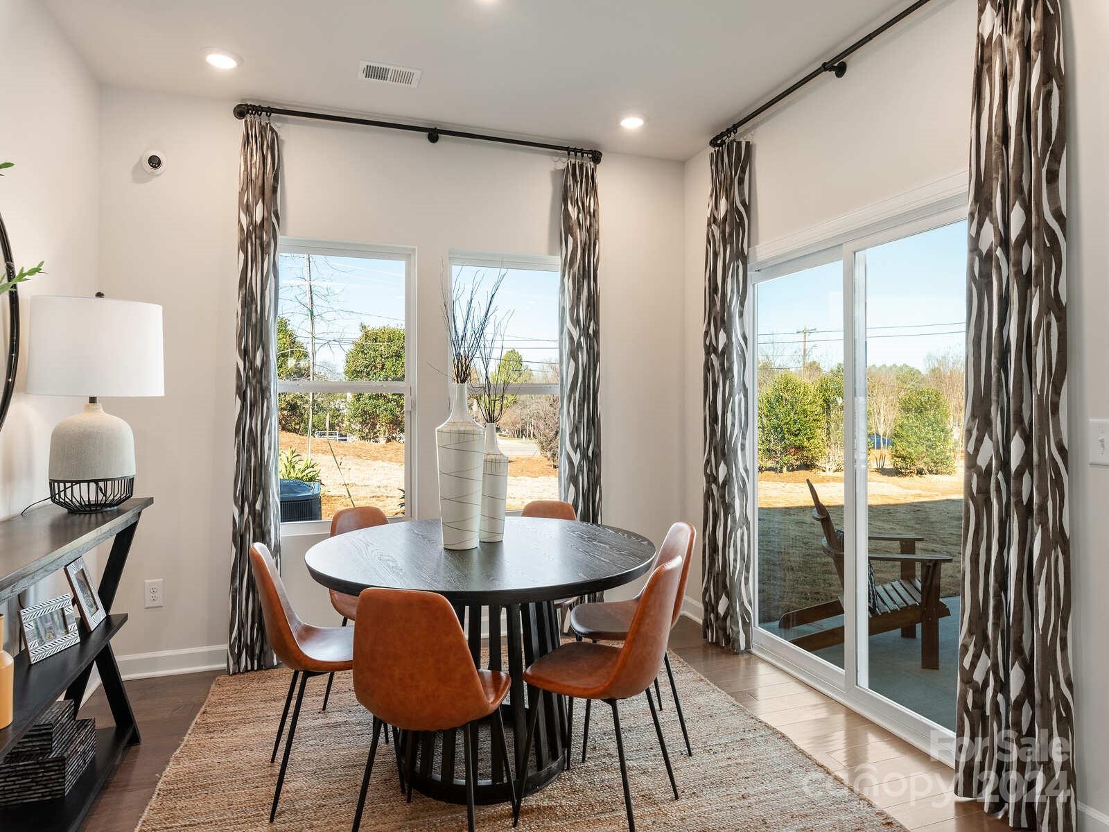 3840 Backwater Street Concord, NC 28027 - Photo 7 of 23 a view of a dining room with furniture window and outside view
