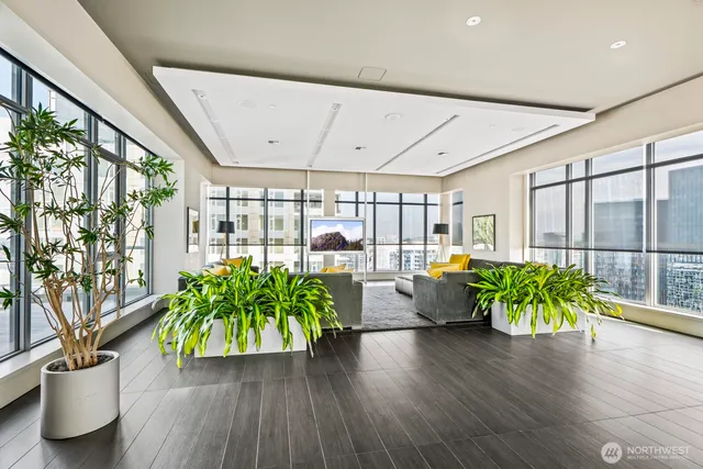 a view of a dining room with furniture window and wooden floor