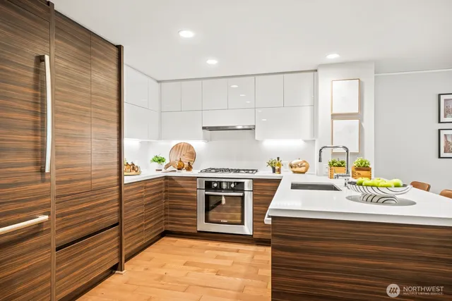 a kitchen with a sink and a large window