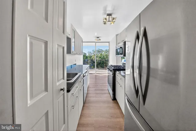 a view of a hallway view with staircase