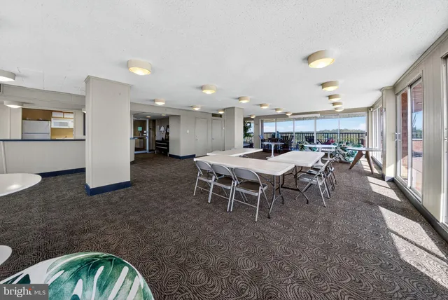 a view of a kitchen with a sink and cabinets